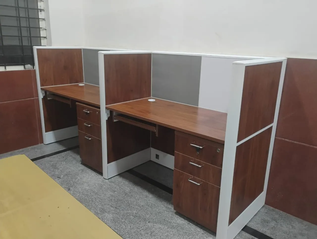 Corner pair of workstations fitted against the granite dado